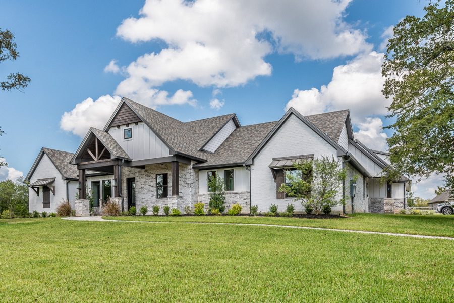 Residential house with professionally installed shingle roof, roofing installation and repair services